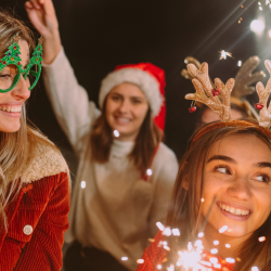 Group of three people having fun at an accessible holiday event.